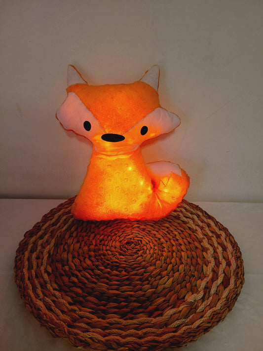 Coussin renard lumineux